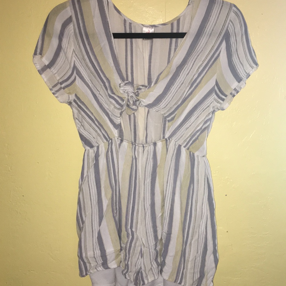 Women’s romper with tie.